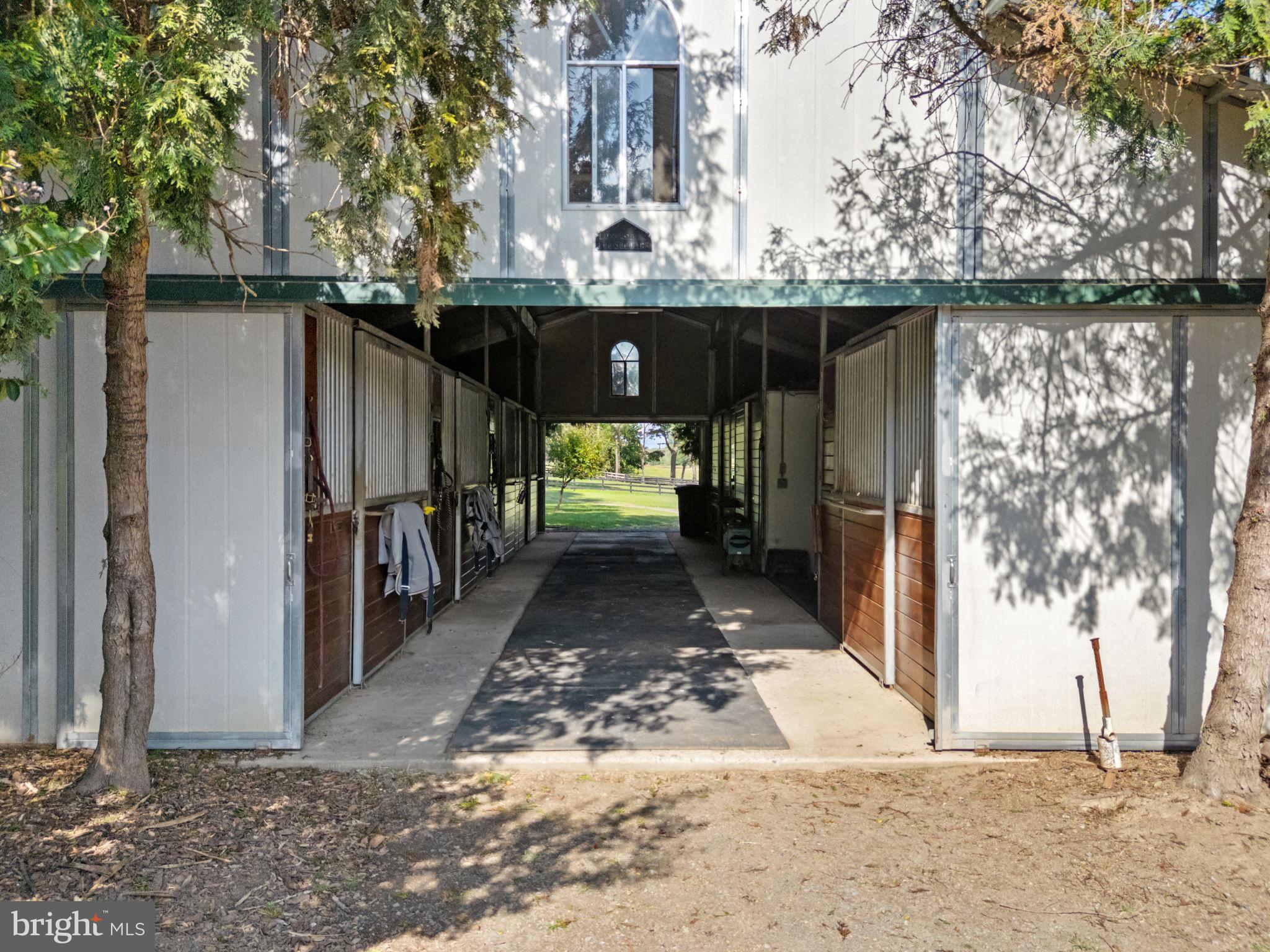 36775 Leith Lane Middleburg, VA 20117 - Photo 48 of 70 a view of a entrance gate of the house and trees