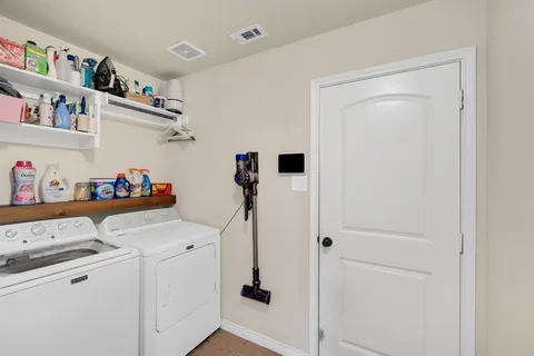 a storage room with washer and dryer