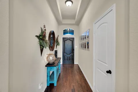 a view of entryway with wooden floor