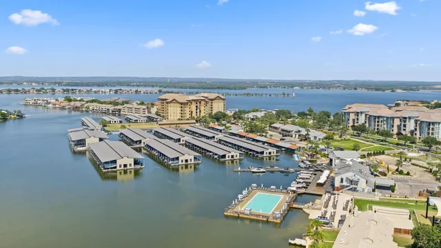 an aerial view of a house with outdoor space lake view
