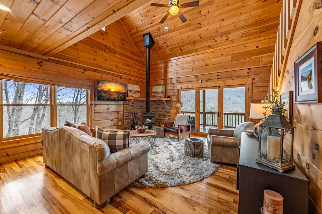 161 Cub Trail Cherry Log, GA 30522 - Photo 16 of 57 a living room with furniture and a floor to ceiling window