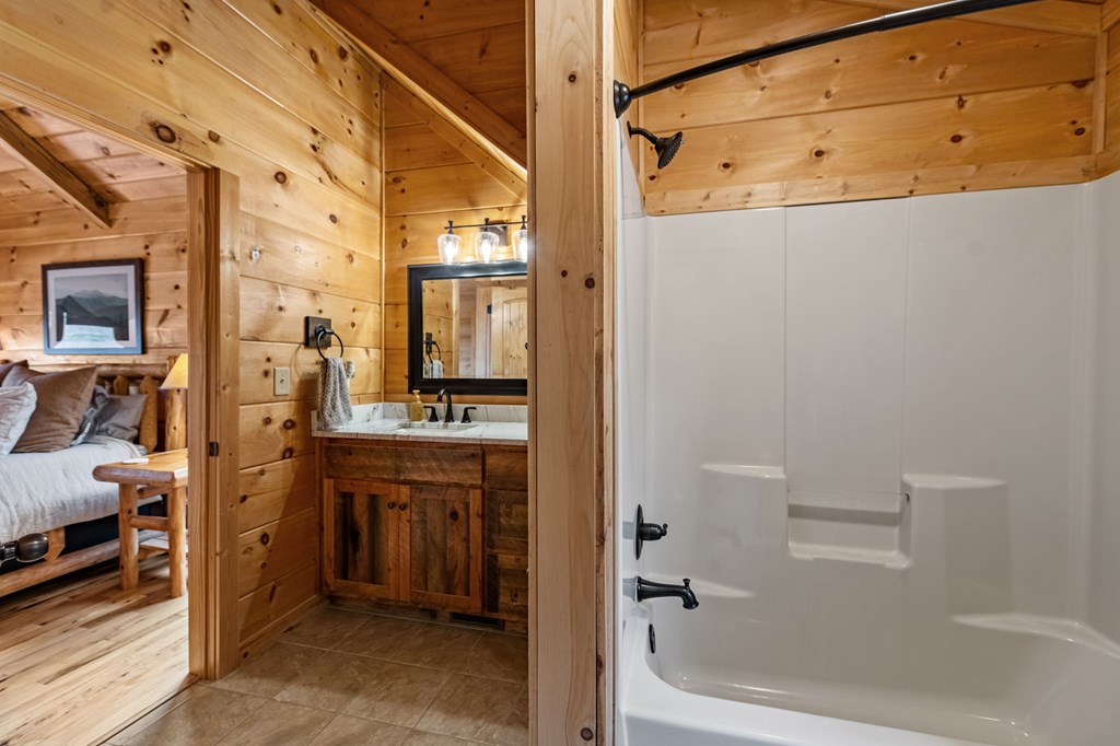 161 Cub Trail Cherry Log, GA 30522 - Photo 24 of 57 a bathroom with a bathtub and a shower