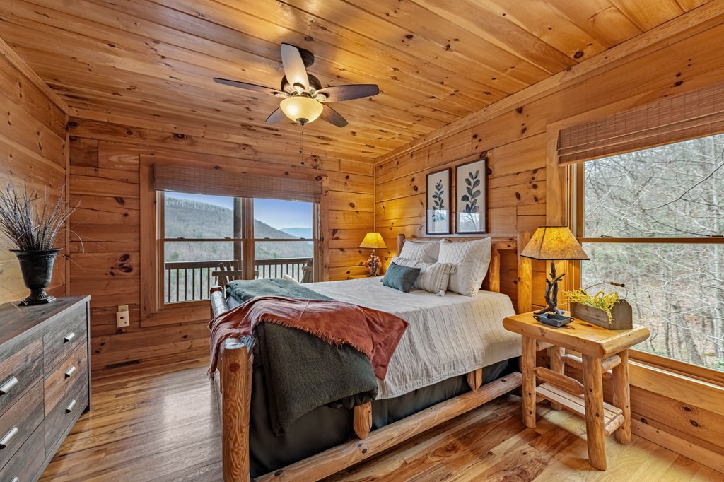 161 Cub Trail Cherry Log, GA 30522 - Photo 31 of 57 a bedroom with a bed and wooden floor