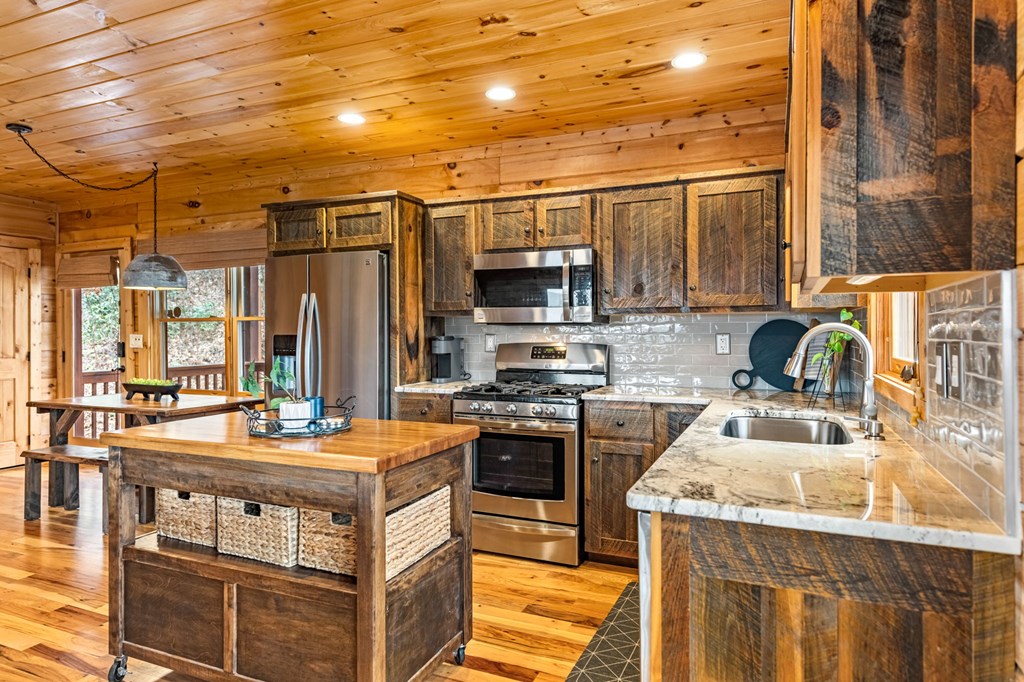 161 Cub Trail Cherry Log, GA 30522 - Photo 4 of 57 a kitchen with a stove a sink and a refrigerator