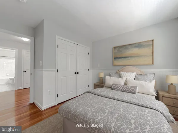 a bed room with a bed and a painting