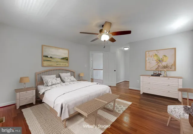 a room with a bed and a chandelier