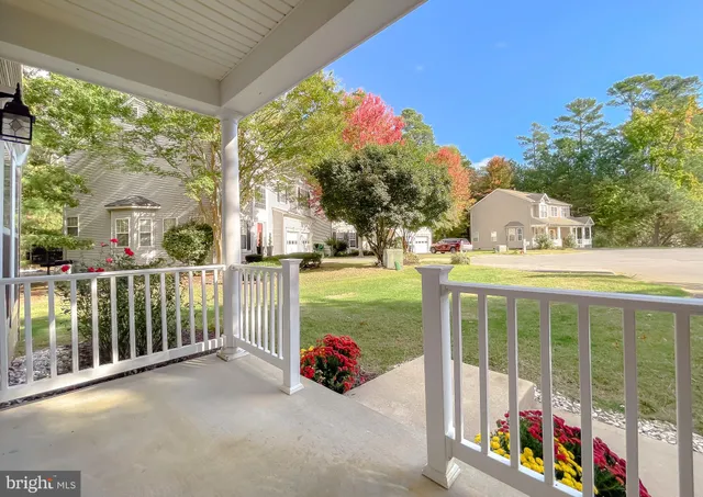 a view of a patio with a table and chairs