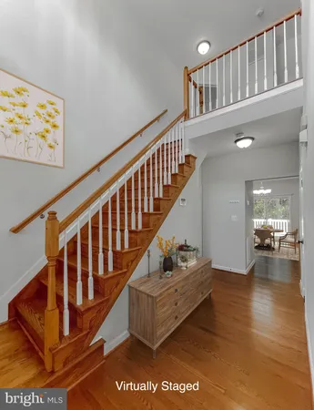a view of entryway livingroom and hall with wooden floor