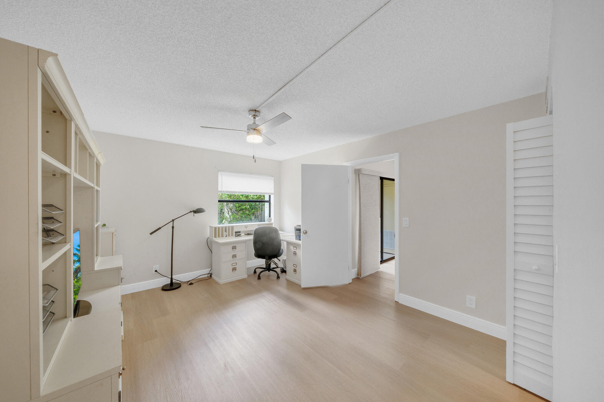 22136 Palms Way, Unit 103 Boca Raton, FL 33433 - Photo 24 of 42 a view of livingroom with furniture and workspace