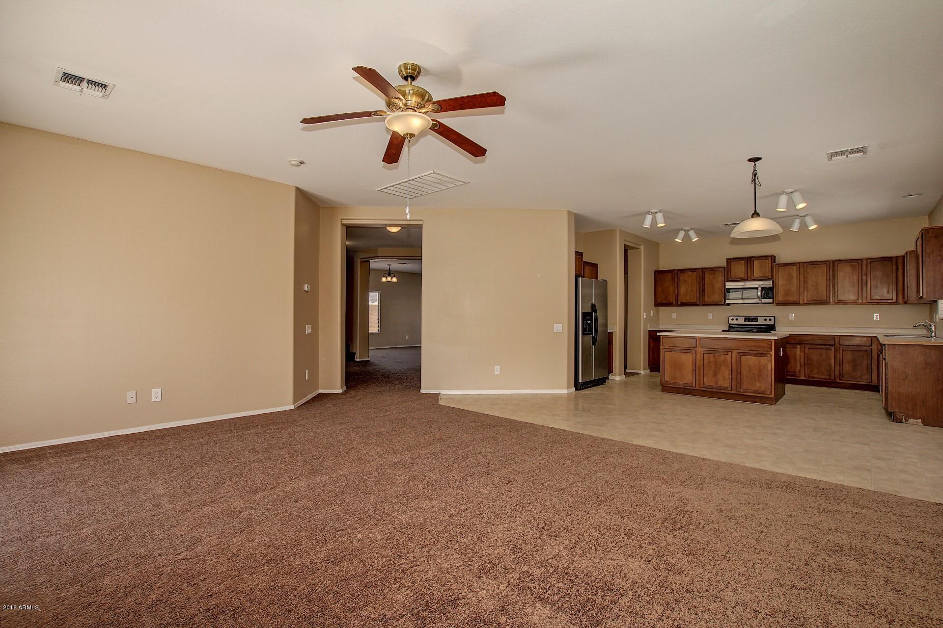 5331 West Apollo Road Laveen, AZ 85339 - Photo 6 of 26 Family room open to kitchen