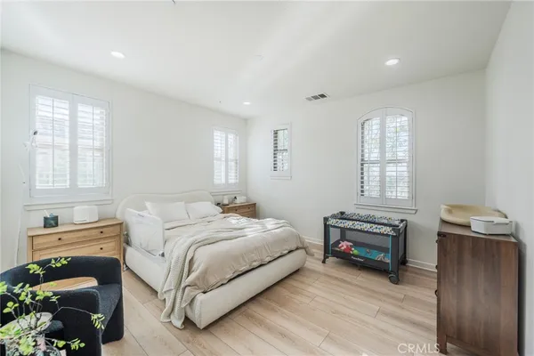 a bed room with a bed and a dresser