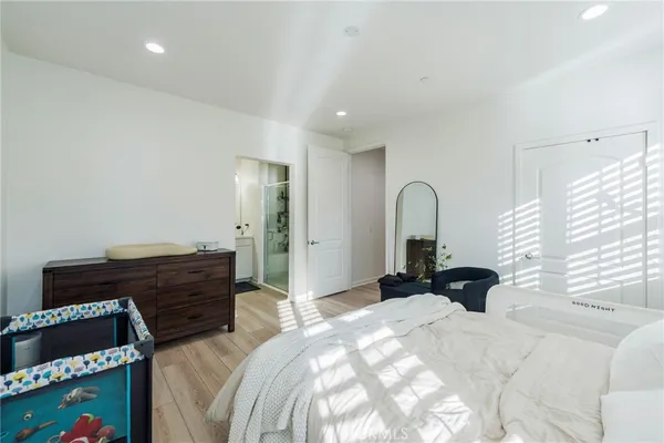 a bathroom with a double vanity sink a mirror and a shower
