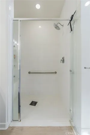 a bed room with a bed and a book shelf