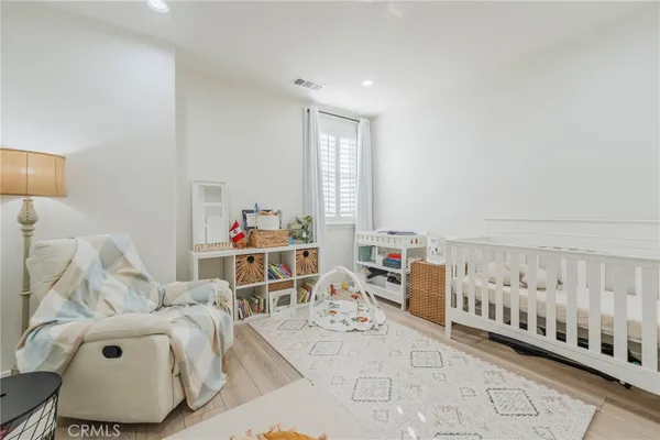 a bathroom with a sink a toilet and shower curtain