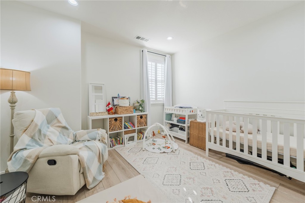 409 Mallorca Lane Brea, CA 92823 - Photo 19 of 40 a living room with furniture and baby crib
