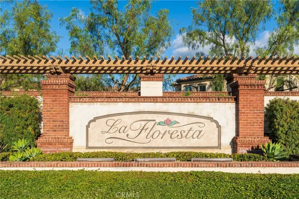 a view of a patio with table and chairs with wooden floor and plants