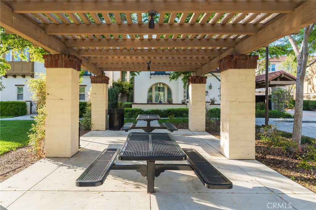 409 Mallorca Lane Brea, CA 92823 - Photo 24 of 40 a view of a patio with table and chairs with wooden floor and plants