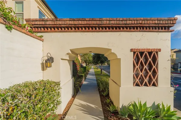 a row of palm trees in front of house