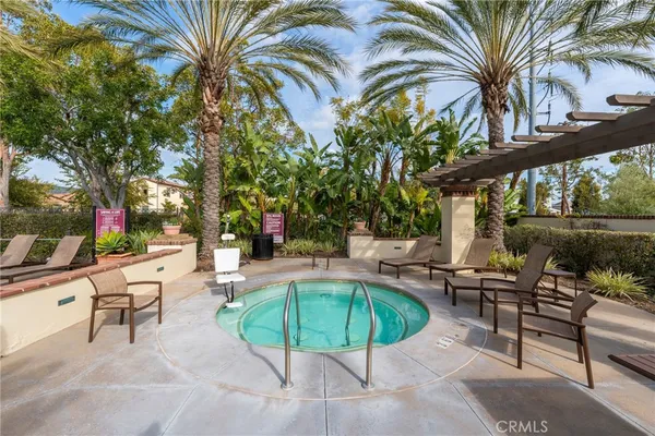 a view of yard with swimming pool and sitting area