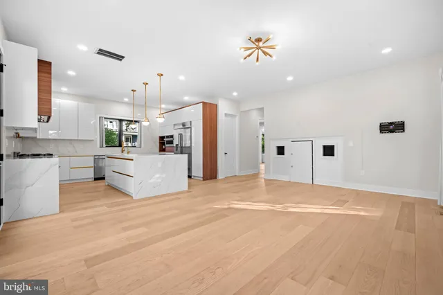 a living room with furniture rug and window