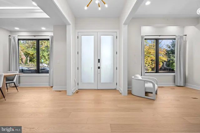 a living room with furniture rug and a fireplace