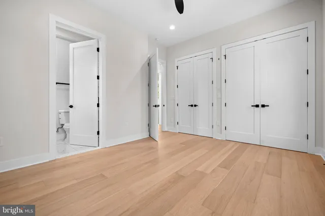a white bath tub sitting next to a bathroom