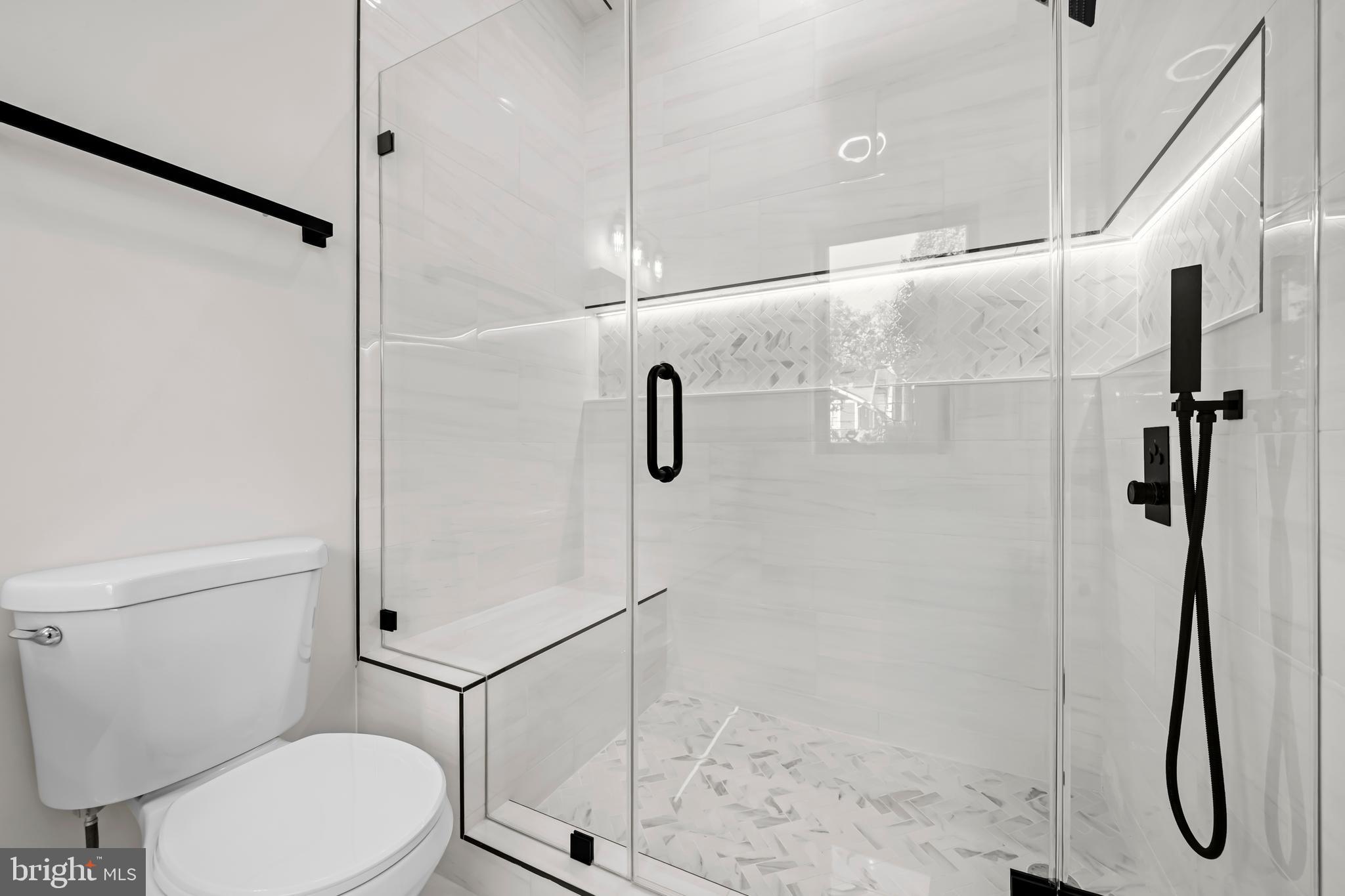 4246 15th Street North Arlington, VA 22207 - Photo 40 of 72 a bathroom with a shower and toilet