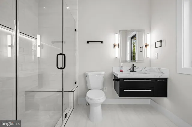 a bedroom with a bed and a potted plant