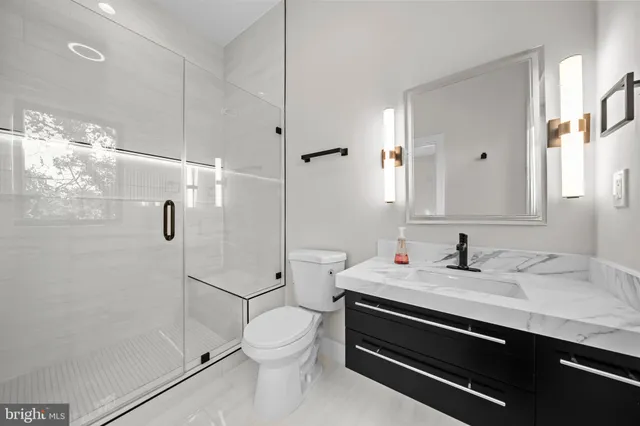 a bedroom with a bed and a walk in closet