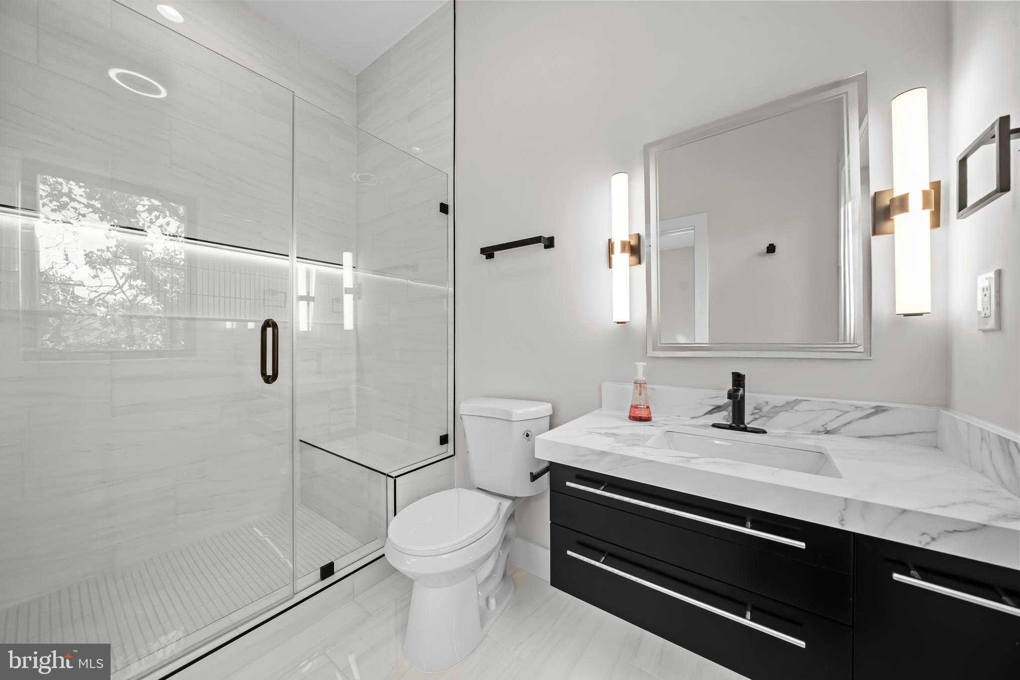 4246 15th Street North Arlington, VA 22207 - Photo 44 of 72 a bathroom with a sink toilet and shower