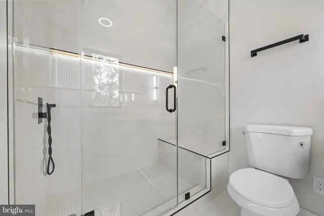 a view of a house with backyard and a tree