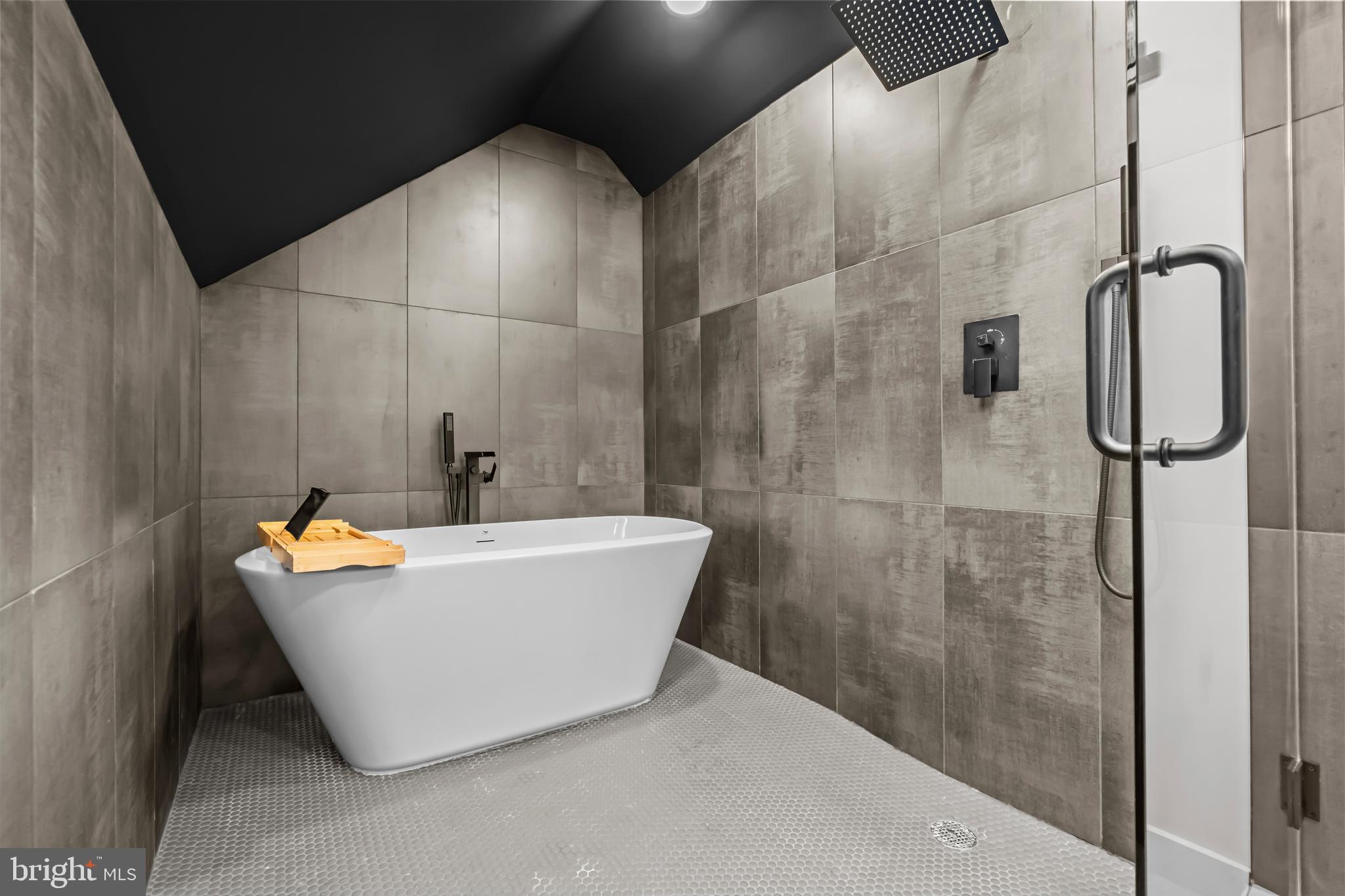 4246 15th Street North Arlington, VA 22207 - Photo 50 of 72 a white bath tub sitting next to a bathroom