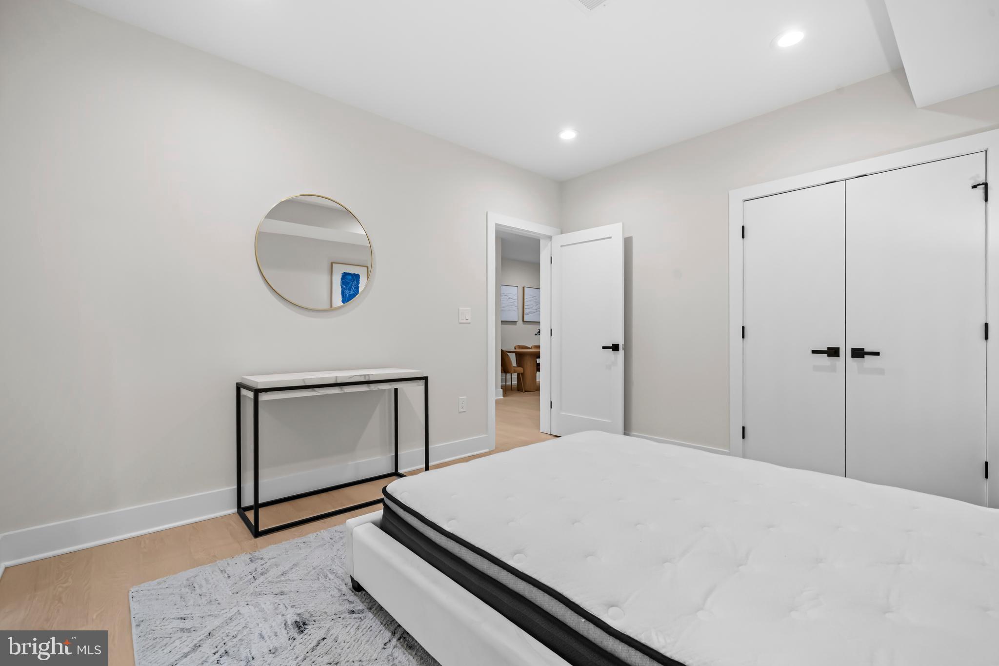 4246 15th Street North Arlington, VA 22207 - Photo 61 of 72 a bedroom with a bed and a wooden floor