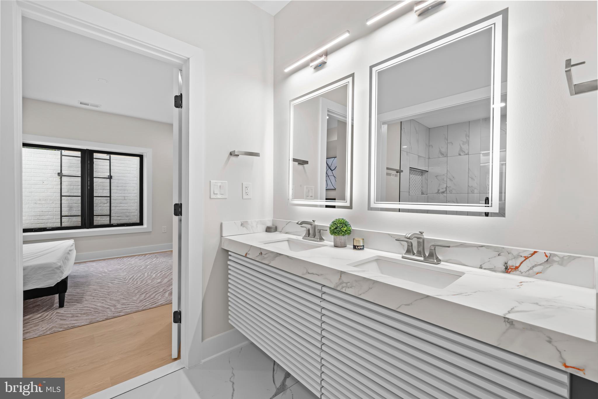 4246 15th Street North Arlington, VA 22207 - Photo 62 of 72 a bathroom with a sink and a mirror