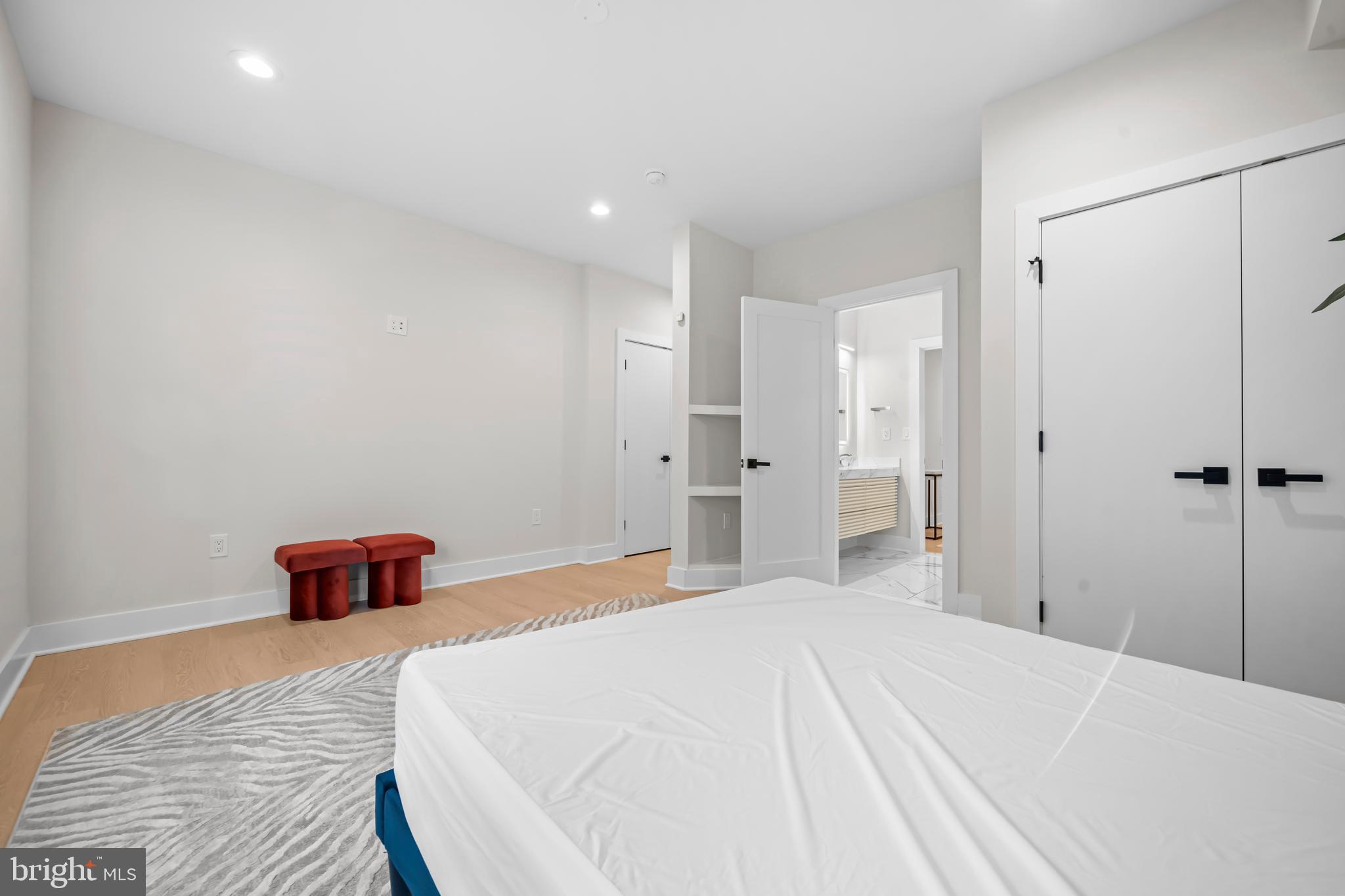 4246 15th Street North Arlington, VA 22207 - Photo 65 of 72 a bedroom with a bed and a walk in closet