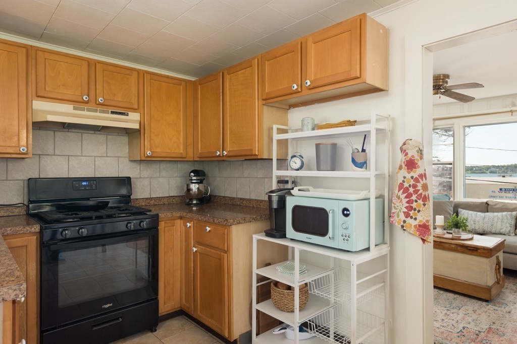 14 Gray Street Wareham, MA 02532 - Photo 14 of 33 a kitchen with stainless steel appliances granite countertop a stove and a microwave