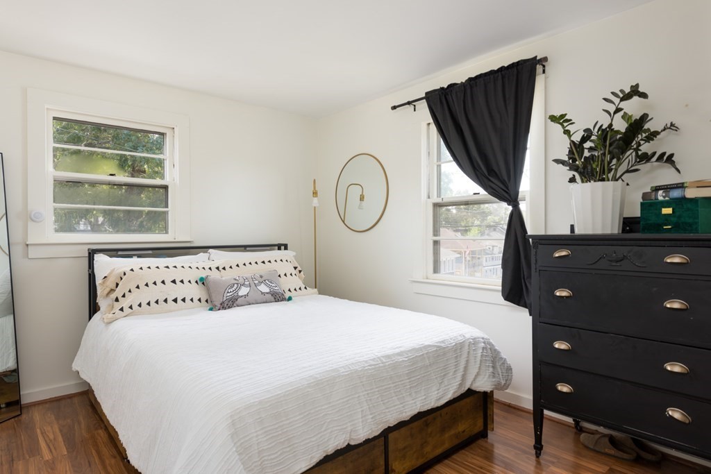 14 Gray Street Wareham, MA 02532 - Photo 17 of 33 a bedroom with a large bed and a potted plant