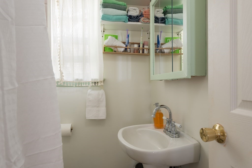 14 Gray Street Wareham, MA 02532 - Photo 19 of 33 a bathroom with a sink and a mirror