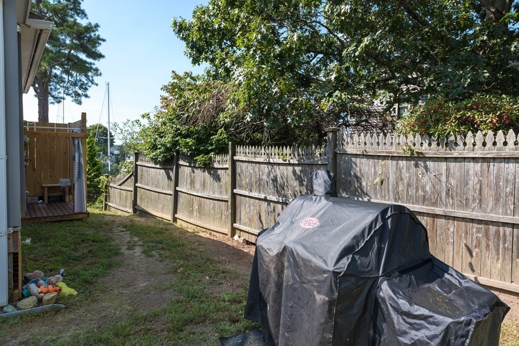 14 Gray Street Wareham, MA 02532 - Photo 21 of 33 a view of a roof deck with couches and wooden fence