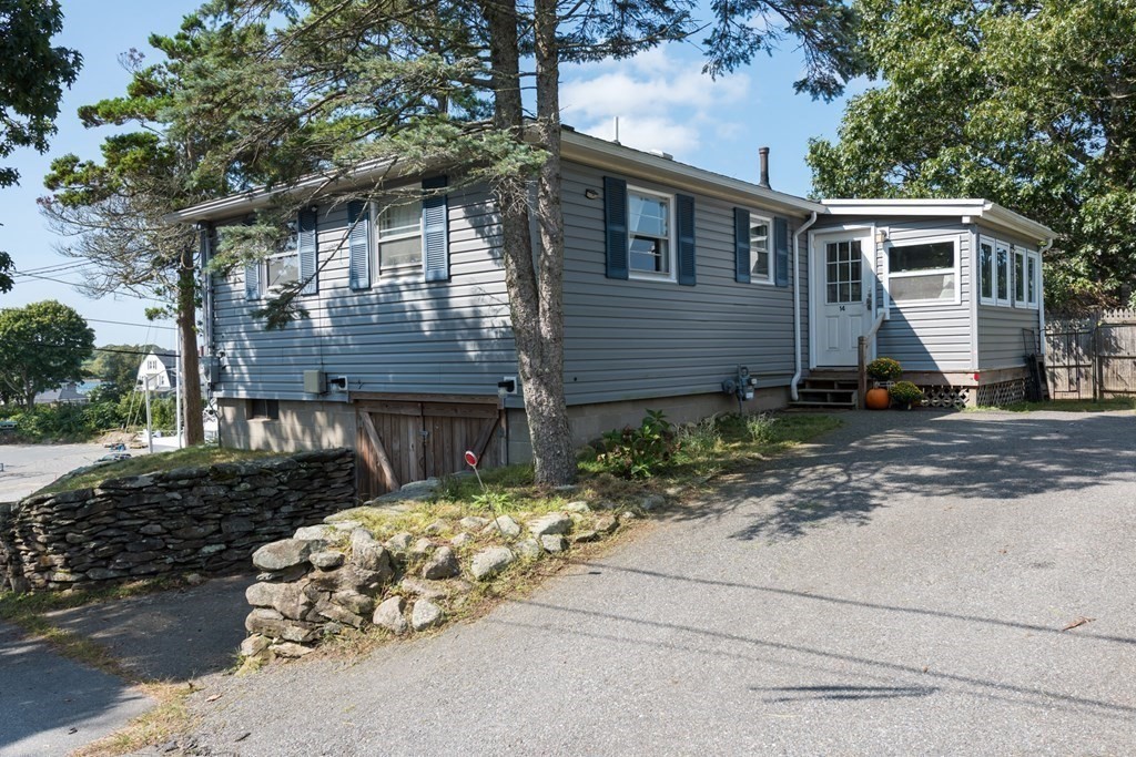 14 Gray Street Wareham, MA 02532 - Photo 10 of 33 a backyard of a house with potted plants and large tree