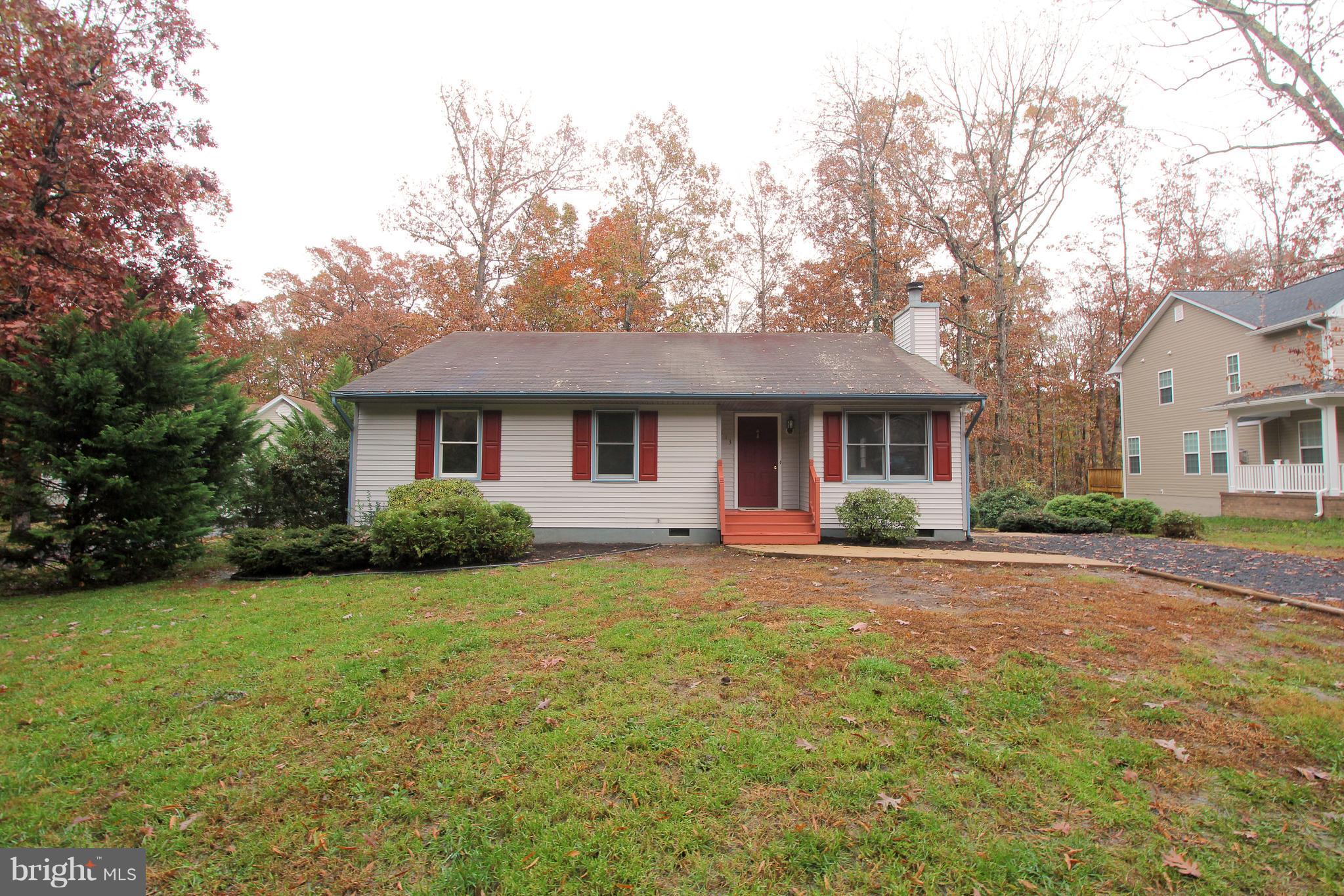 113 Saylers Creek Road Locust Grove, VA 22508 - Photo 1 of 29 a front view of a house with yard and green space
