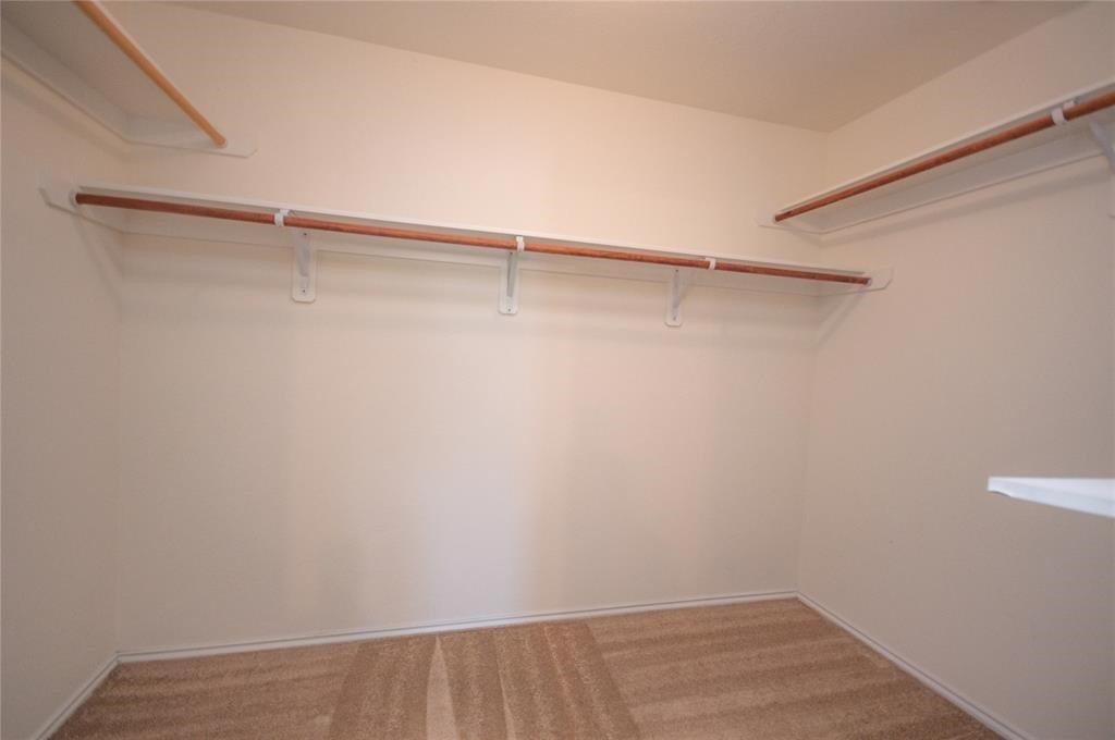 310 Falling Pine Drive Conroe, TX 77304 - Photo 14 of 15 a view of an empty walk in closet