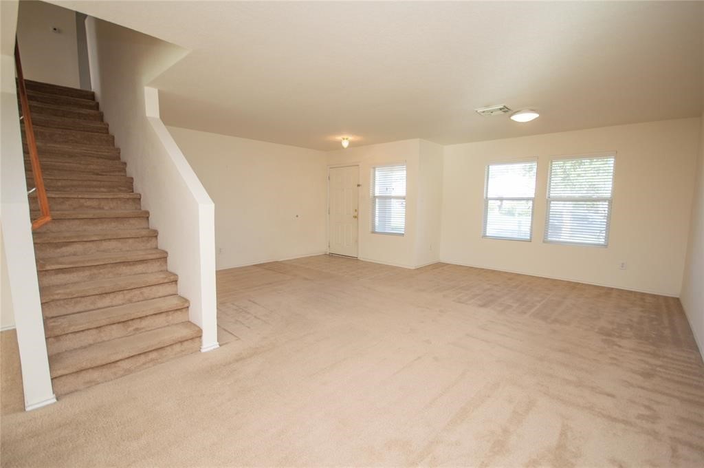 310 Falling Pine Drive Conroe, TX 77304 - Photo 3 of 15 a view of an empty room with windows