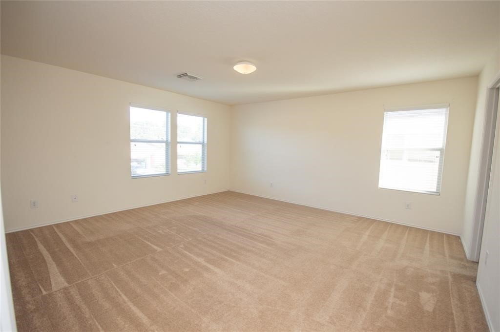 310 Falling Pine Drive Conroe, TX 77304 - Photo 9 of 15 an empty room with windows