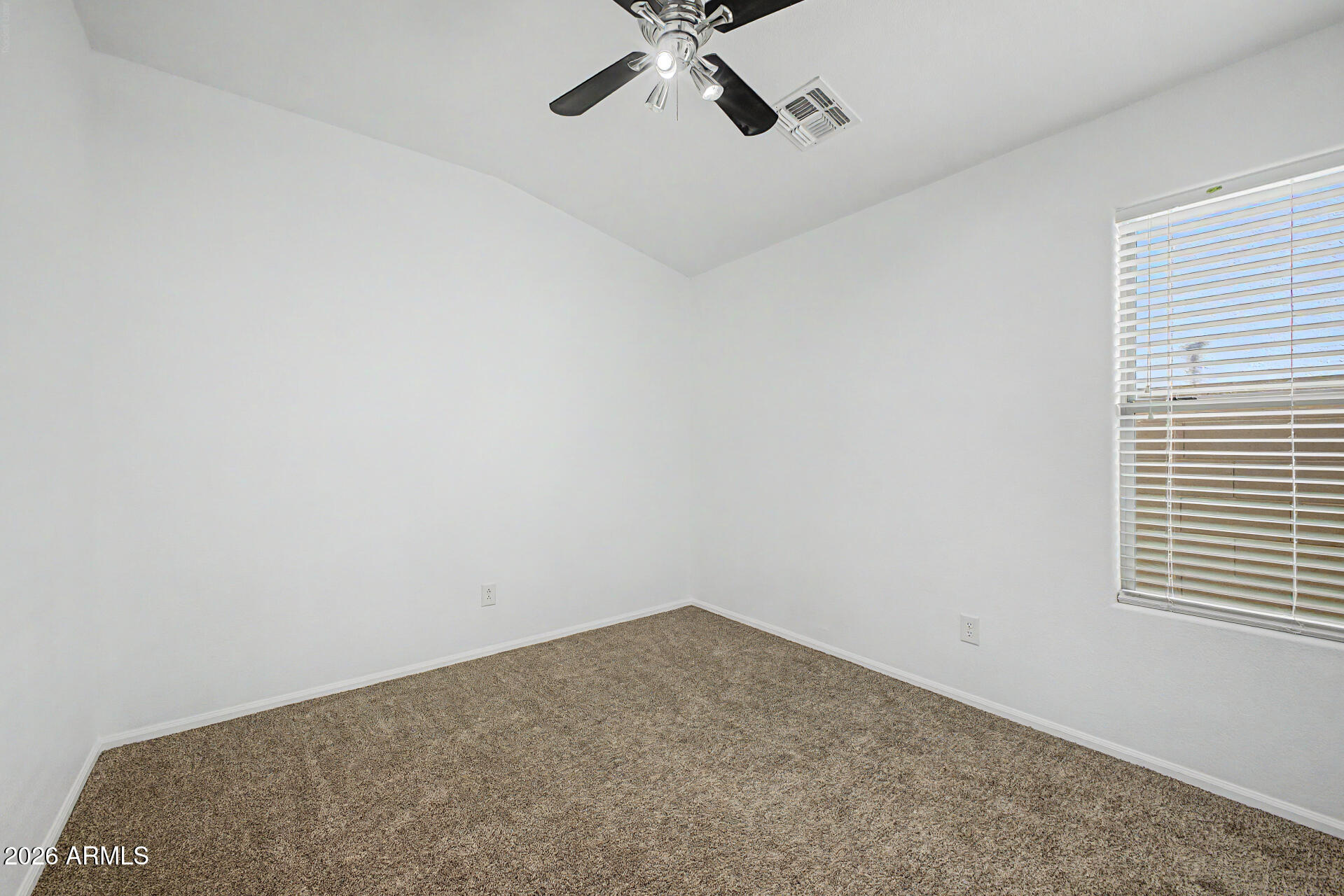 4168 East Sandy Way Gilbert, AZ 85297 - Photo 24 of 47 a view of a room with a ceiling fan and a window