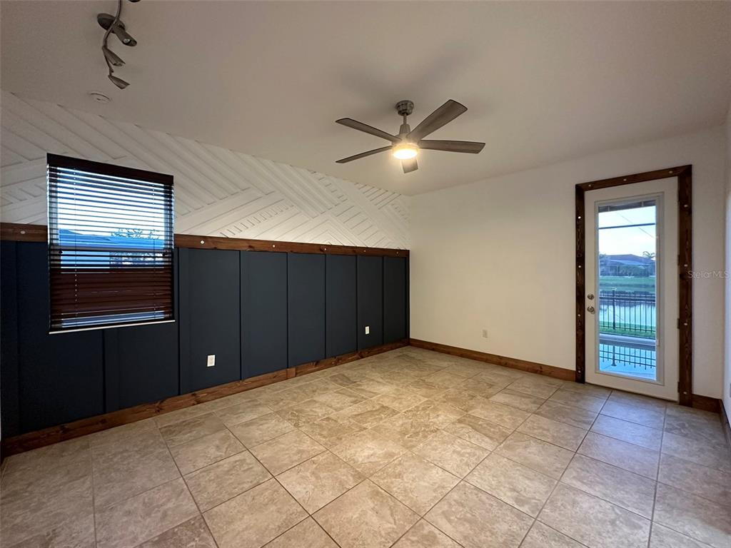 3008 Boat Lift Road Kissimmee, FL 34746 - Photo 22 of 56 a view of an empty room with a ceiling fan