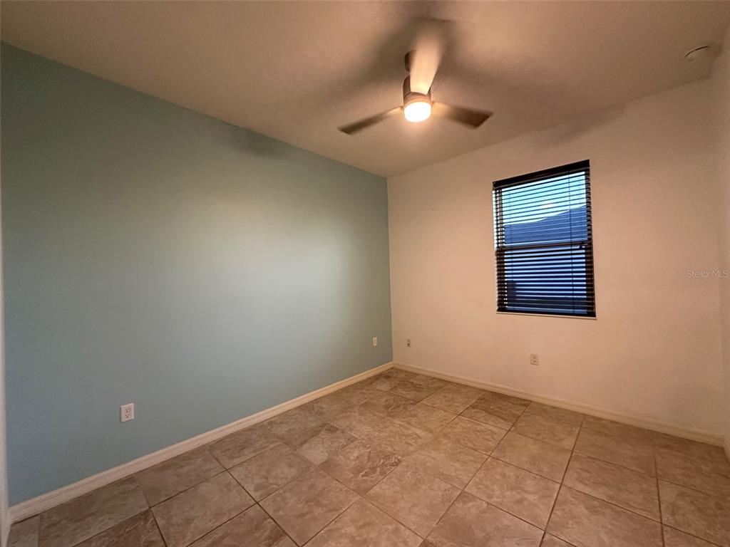 3008 Boat Lift Road Kissimmee, FL 34746 - Photo 33 of 56 an empty room with a chandelier fan