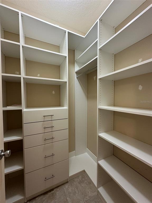 3008 Boat Lift Road Kissimmee, FL 34746 - Photo 36 of 56 a view of walk in closet with empty racks