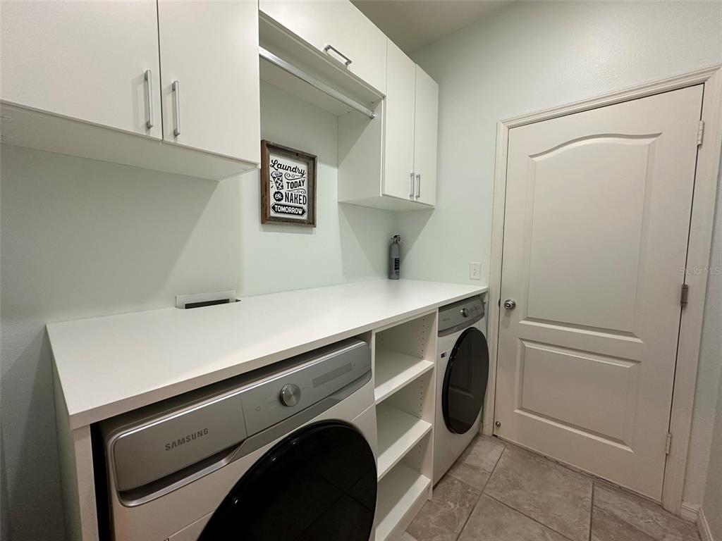 3008 Boat Lift Road Kissimmee, FL 34746 - Photo 37 of 56 a utility room with dryer and washer