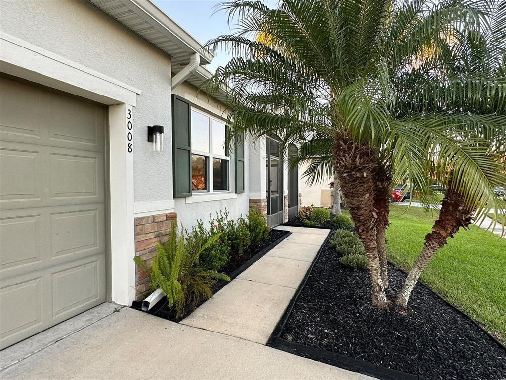 3008 Boat Lift Road Kissimmee, FL 34746 - Photo 4 of 56 a front view of a house with garden